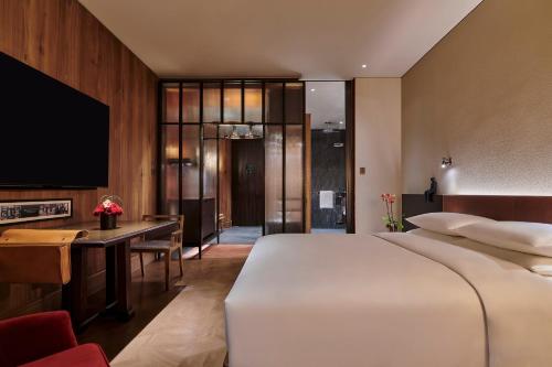 Cama ou camas em um quarto em Mumian Beijing Daxing International Airport