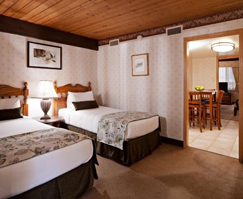 A bed or beds in a room at Charltons Banff