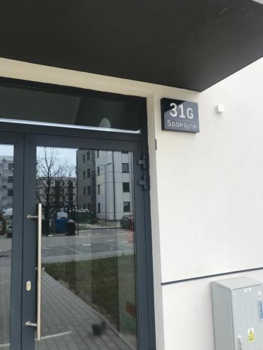 a door of a building with a sign on it at Apartament Platinum Park in Stargard