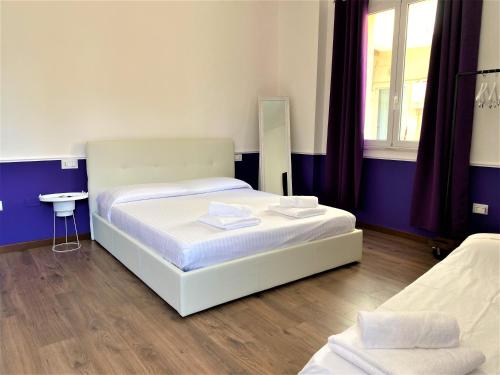 Rúm í herbergi á Myrtus Guest House Cagliari