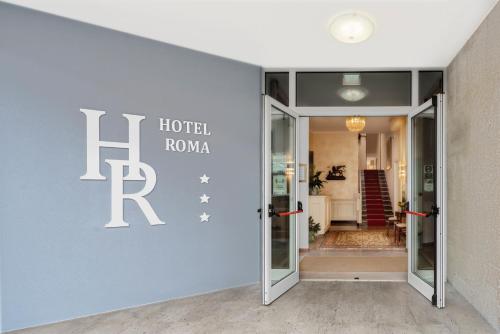 Un certificat, premiu, logo sau alt document afișat la Hotel Roma