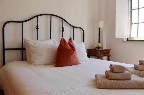 Una cama o camas en una habitación de Casas de Mar - Casa Coral