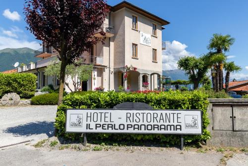 a hotel sign in front of a building at Hotel Il Perlo in Bellagio