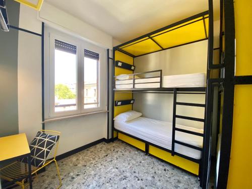 Una cama o camas en una habitación de YellowSquare Milan