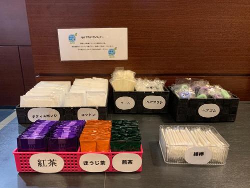 a display of different types of soap on a table at Smile Hotel Nagoya Sakae in Nagoya