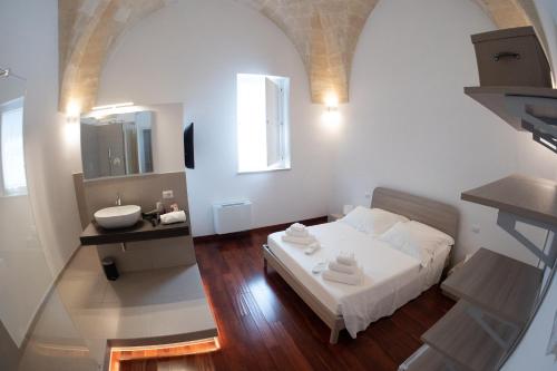 Una cama o camas en una habitación de Tulliani Residenze Matera