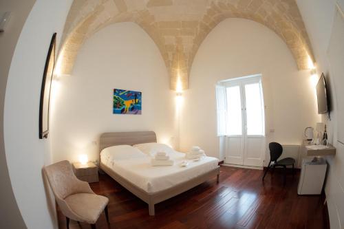 Una cama o camas en una habitación de Tulliani Residenze Matera