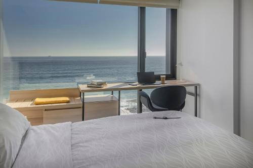 Tempat tidur dalam kamar di Pullman Vina del Mar San Martin