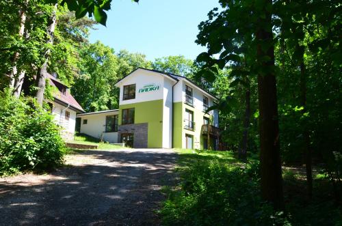 a building in the middle of a forest at Penzión NADKA in Bojnice