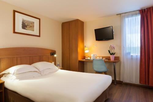 Posteľ alebo postele v izbe v ubytovaní Comfort Hotel Amiens Nord