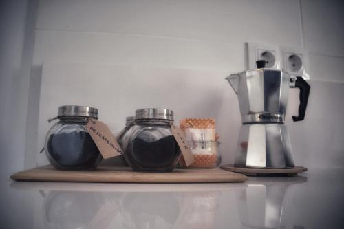 a shelf with two jars and a blender on it at BELIA A.T. in Cáceres