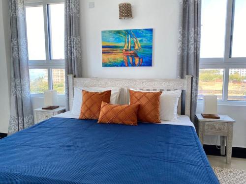 Tempat tidur dalam kamar di Nyali Emirates Reef Apartment