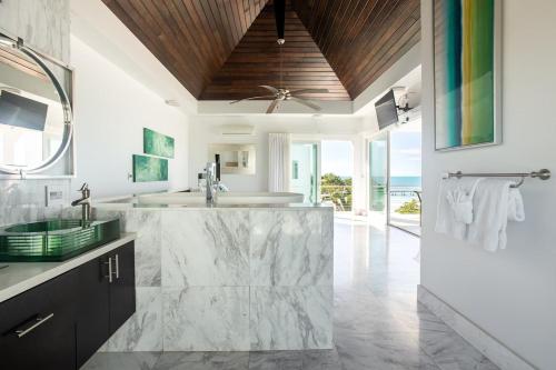 A kitchen or kitchenette at SulMare at Sapodilla Bay Luxury villas