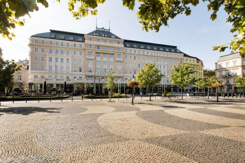 a large building with a large plaza in front of it at Radisson Blu Carlton Hotel, Bratislava in Bratislava