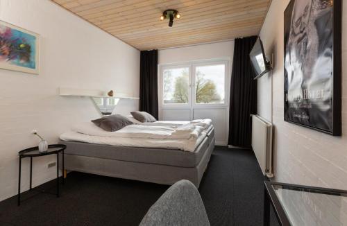 Letto o letti in una camera di Dolphin Hotel Herning