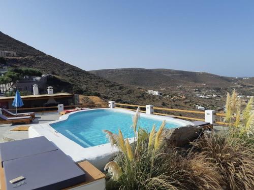 a large swimming pool sitting on top of a house at 3 Paros *All Season* Villas in Parikia