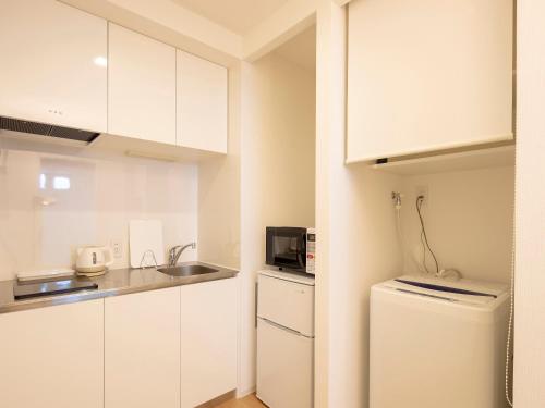 Una cocina o kitchenette en Family Inn Kei 慶