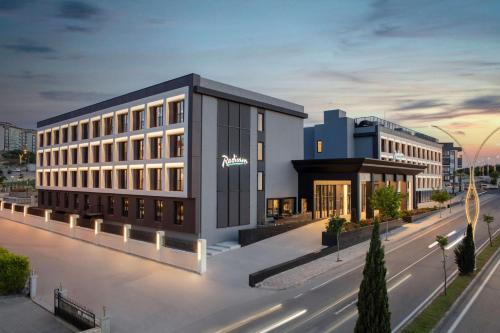 a rendering of a building on a city street at Radisson Hotel Izmir Aliaga in Izmir