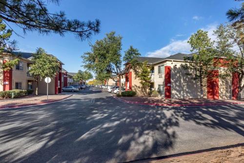 a street in a town with houses and trees at Suburban Studios in Albuquerque