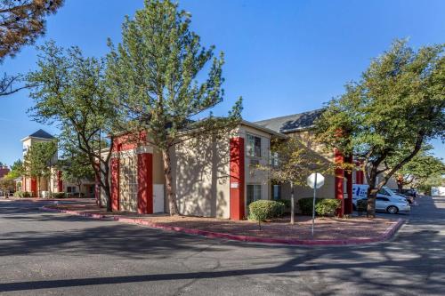 a house with red and white paint on it at Suburban Studios in Albuquerque