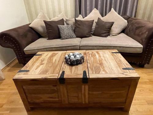 a living room with a couch and a coffee table at Remarkable home Bohinj Lake in Bohinj