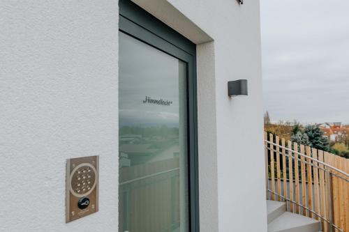 a window with a view of a balcony at Village Turmzimmer in Kehl am Rhein