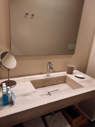 a bathroom with a sink with a mirror at Al Molo di Sant'Agostino in Como