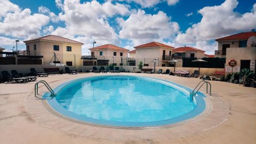 Bazén v ubytování Duplex con Piscina Corralejo, Wi-fi, TV Satélite nebo v jeho okolí