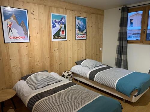 Una cama o camas en una habitación de CHALET Mitoyen LE RUSTICANA