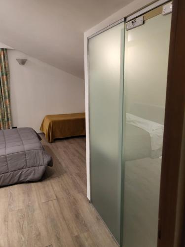 Una cama o camas en una habitación de Hotel Miage