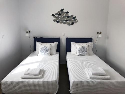 A bed or beds in a room at Bay View Villas