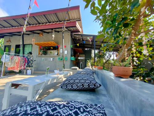 two pillows sitting on a table in front of a building at DOX Ko Lanta in Ko Lanta