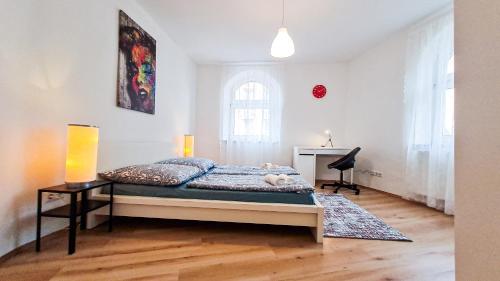 En eller flere senger på et rom på Luxuriöses Apartment im Zentrum von Nürnberg