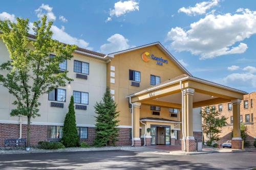 a rendering of a hotel with a building at Comfort Inn Downtown - University Area in Kalamazoo