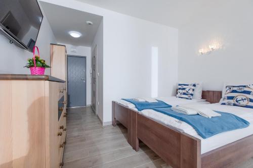 Ένα ή περισσότερα κρεβάτια σε δωμάτιο στο Apartament "Chamesz" Dziwnówek