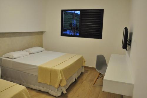 Una cama o camas en una habitación de Hotel Peregrinos