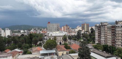 a view of a city with tall buildings at Departamento Torre Murguía in San Salvador de Jujuy