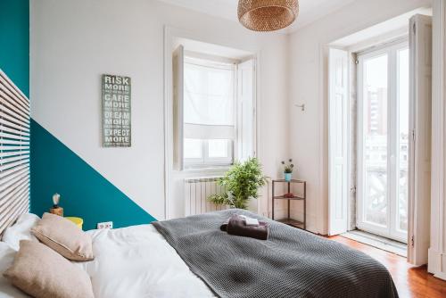 A bed or beds in a room at The Salty Pelican Beach Retreat