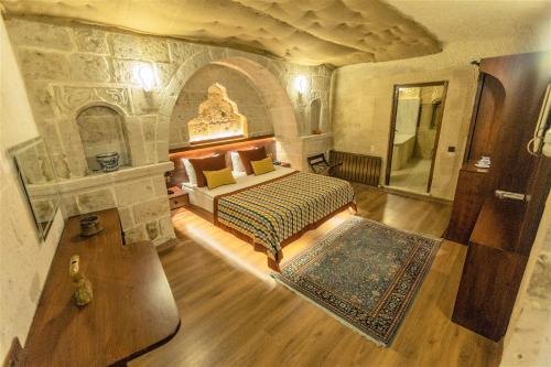 Voodi või voodid majutusasutuse Mimi Cappadocia Luxury Cave Hotel toas