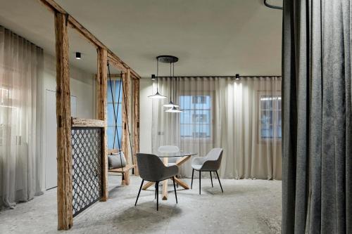 a dining room with a table and chairs at Truma Swing Luxury in Merano