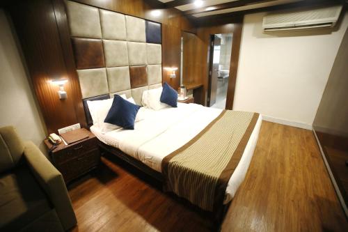 a bedroom with a large bed in a room at The Byke Heritage Adventure Park & Resort, Matheran in Matheran