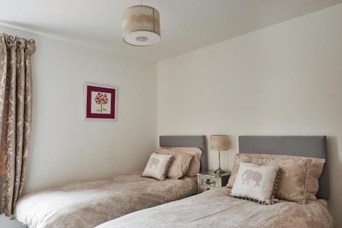 Krevet ili kreveti u jedinici u okviru objekta Aviemore apartment (pet friendly) - sleeps 4