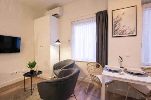 Televizorius ir (arba) pramogų centras apgyvendinimo įstaigoje Four Star Apartments - Keizerstraat