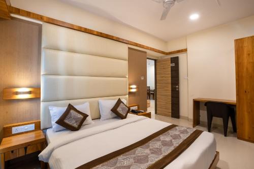 Krevet ili kreveti u jedinici u objektu Home2 Suites and Service Apartments, Mumbai Airport