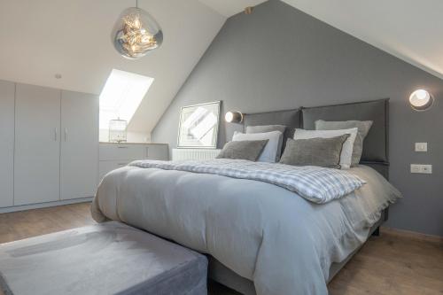 a bedroom with a large bed in a attic at Charmes en Chambertin in Gevrey-Chambertin