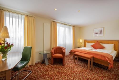 เตียงในห้องที่ GAIA Hotel Basel - the sustainable 4 star hotel