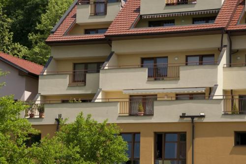 a building with balconies on the side of it at Gizela in Luhačovice