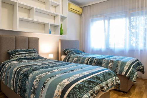 Tempat tidur dalam kamar di Luxury apartment Podgorica