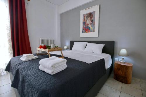 Кровать или кровати в номере Angelina’s Boutique Suite in Nafplio City