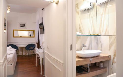 a bathroom with a sink and a toilet at Mama House Roma in Rome